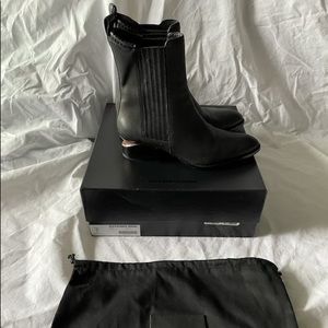 Black Alexander Wang Chelsea Boots -with rose gold cut outs.